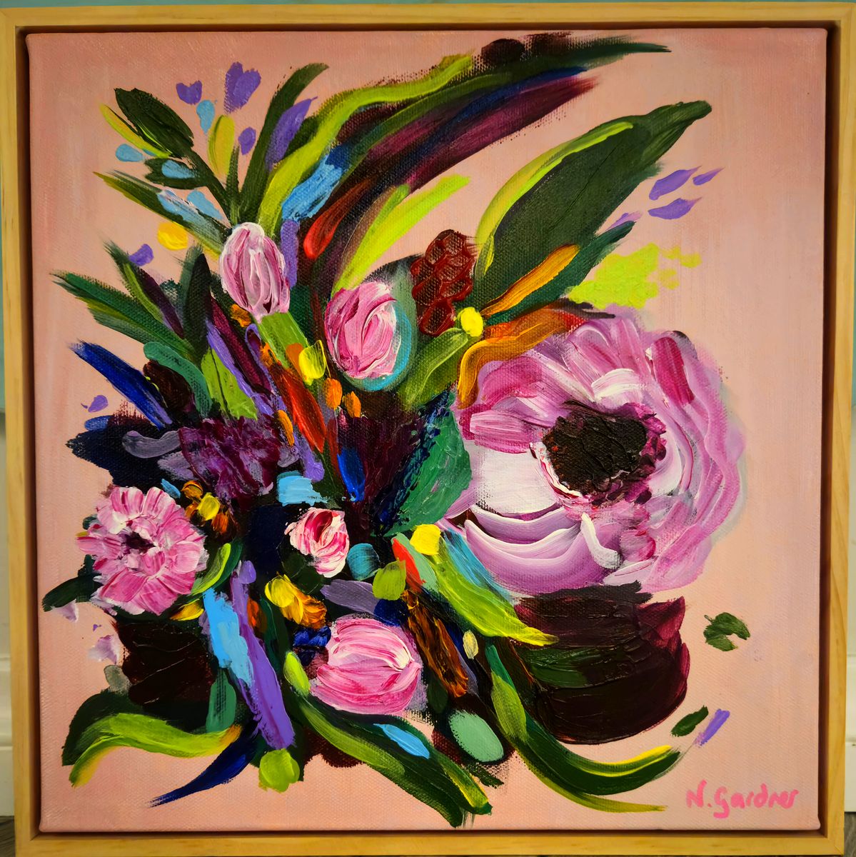 Original expressive painting of a wild bouquet in pinks, purples and greens on a blush pink background, framed in pine