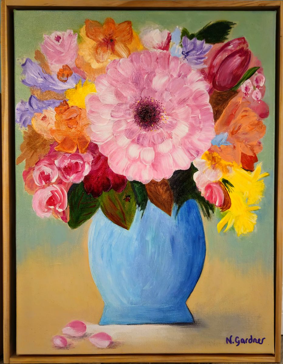 Original painting of a large pink gerbera in a blue vase surrounded by colourful blooms, framed in pine