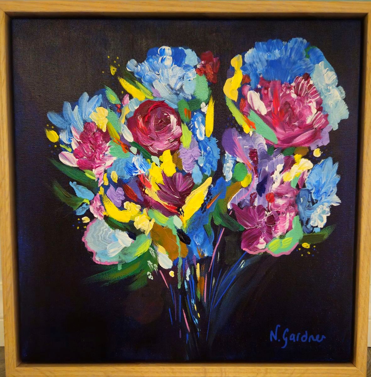 Original painting of a vivid multicoloured bouquet glowing against a midnight-dark background, framed in solid oak